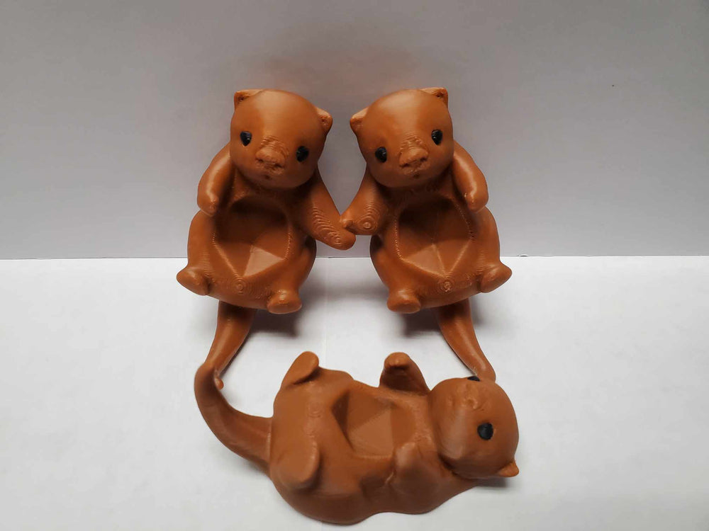 Otters Holding Hands: Dice Holder