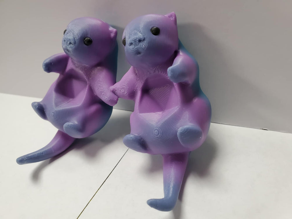 Otters Holding Hands: Dice Holder